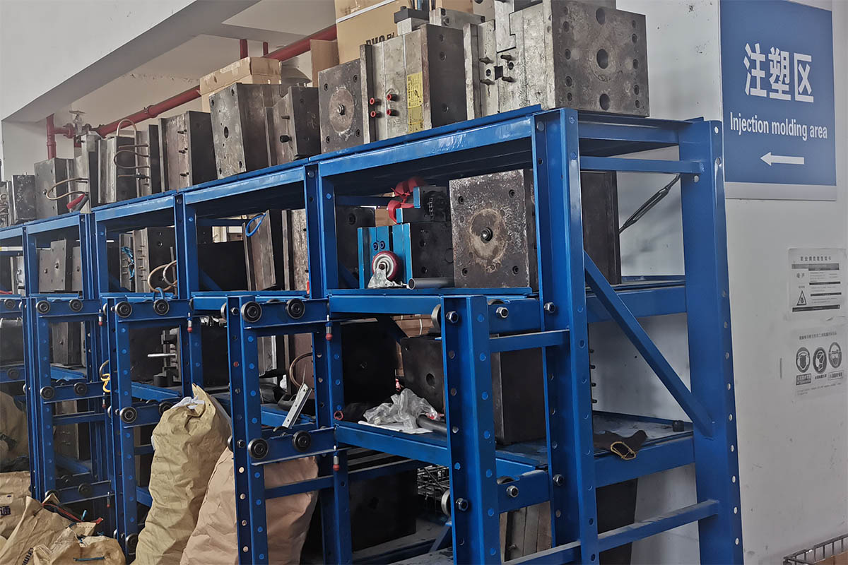On-site mold storage rack with 200+ active tooling sets and PP raw material